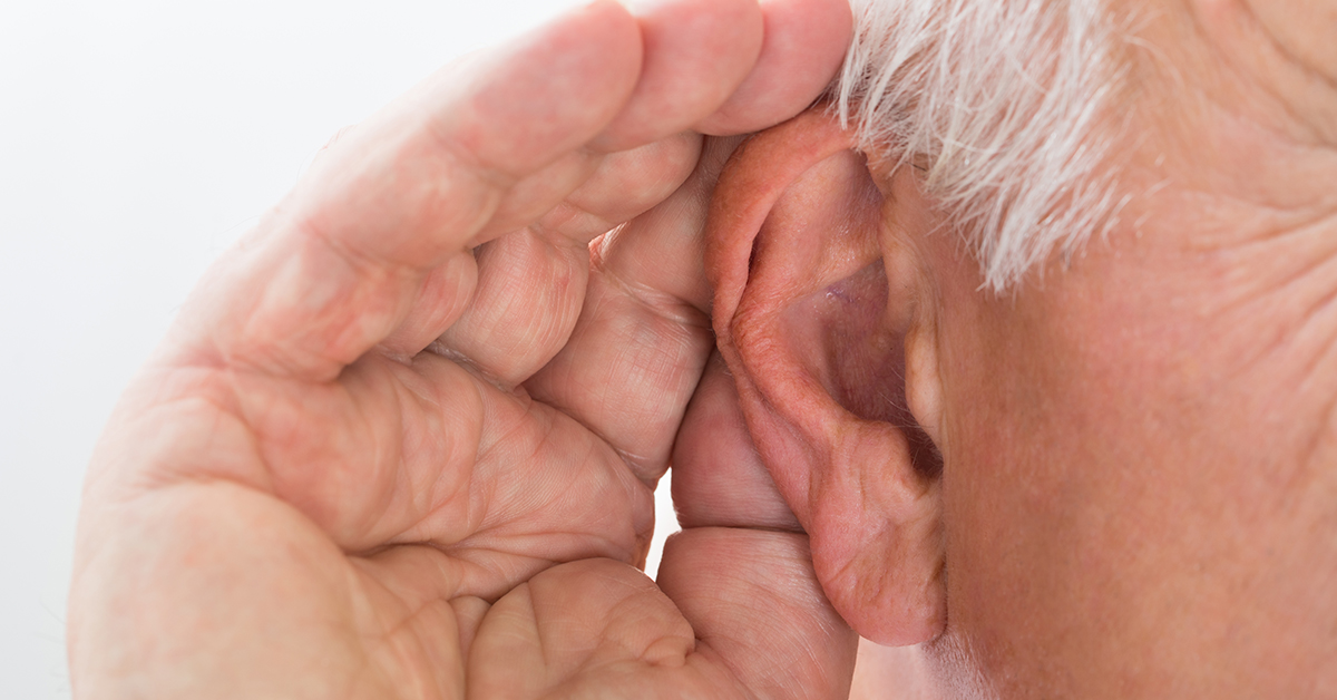 Hand cupping an ear, straining to hear