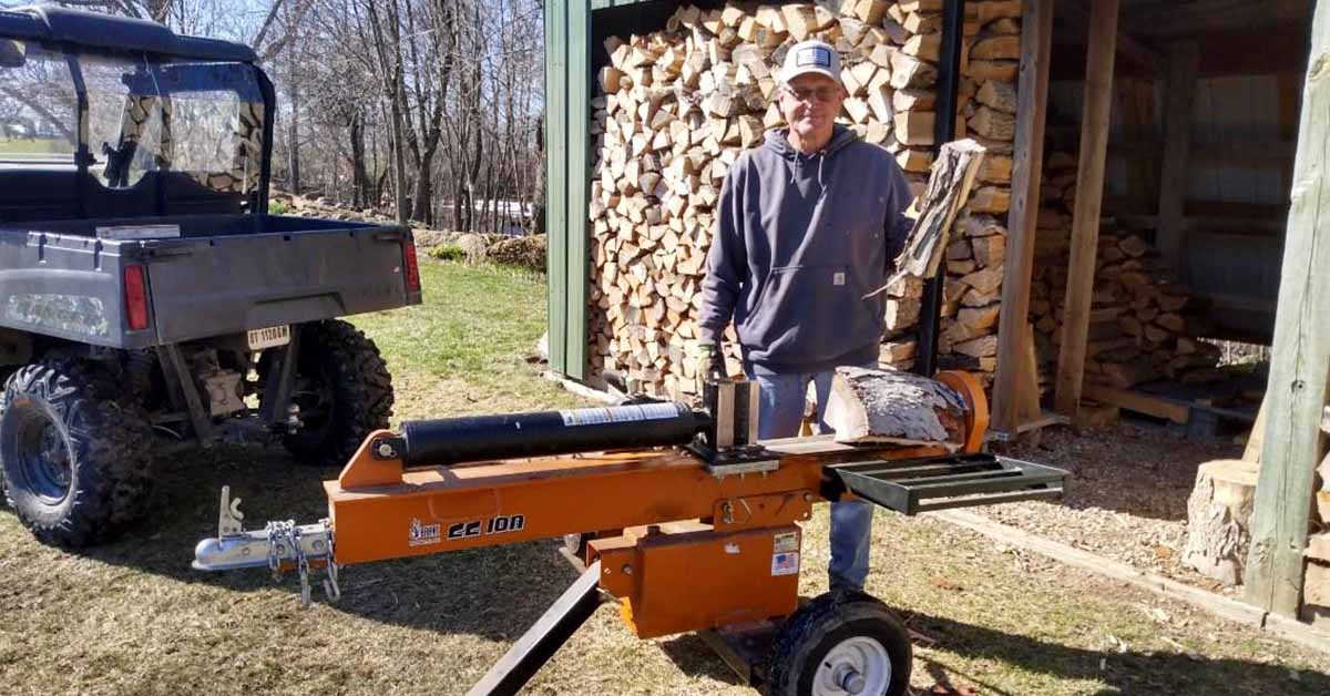 Keith Broadway splits and stacks wood at his home in Waupun.