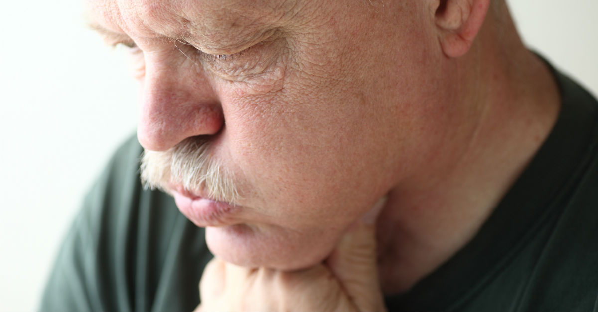 Closeup shot of man visibly clearing throat.